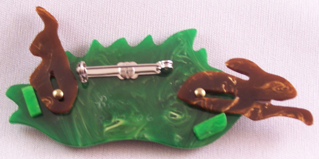 AB9 Beau rabbits in tulip patch bakelite pin